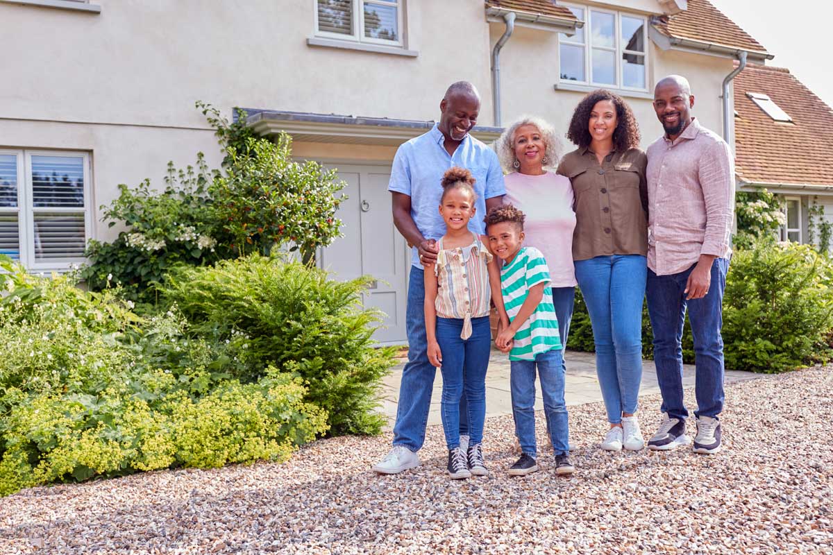 A family in front of a house